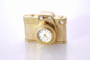 Gold Coloured Metal Miniature Clock With Quartz Movement Shaped as a Camera